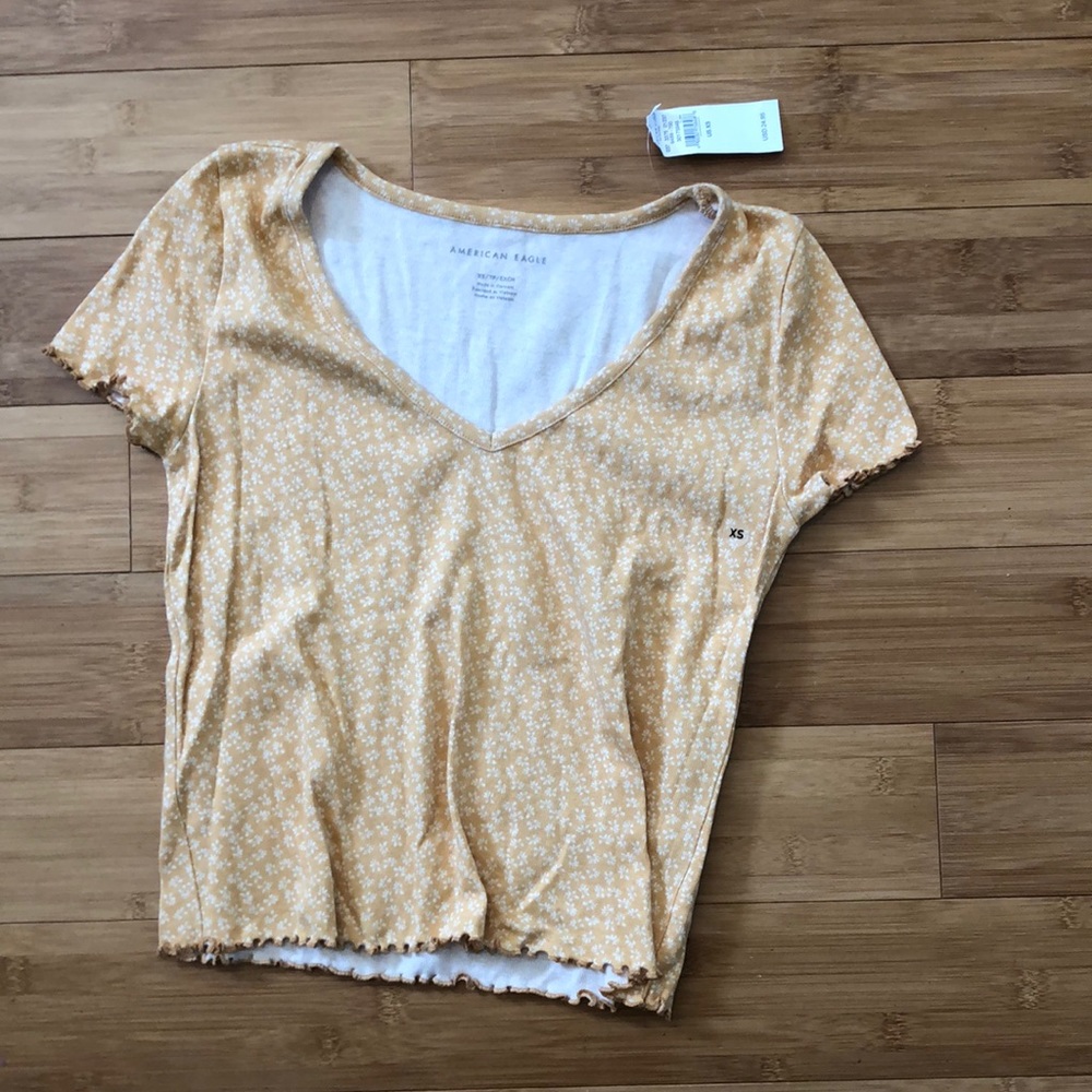 Yellow top with floral pattern